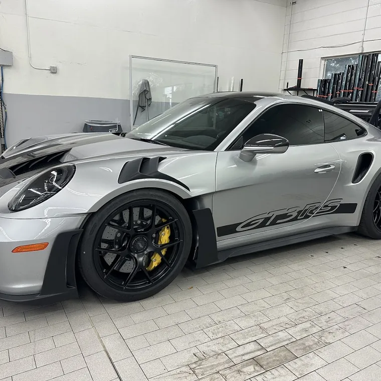 A silver Porsche 911 GT3 RS in the workshop