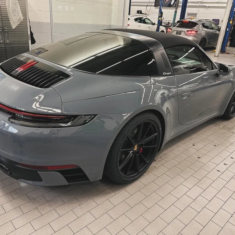 A grey Porsche 911 Targa in the workshop